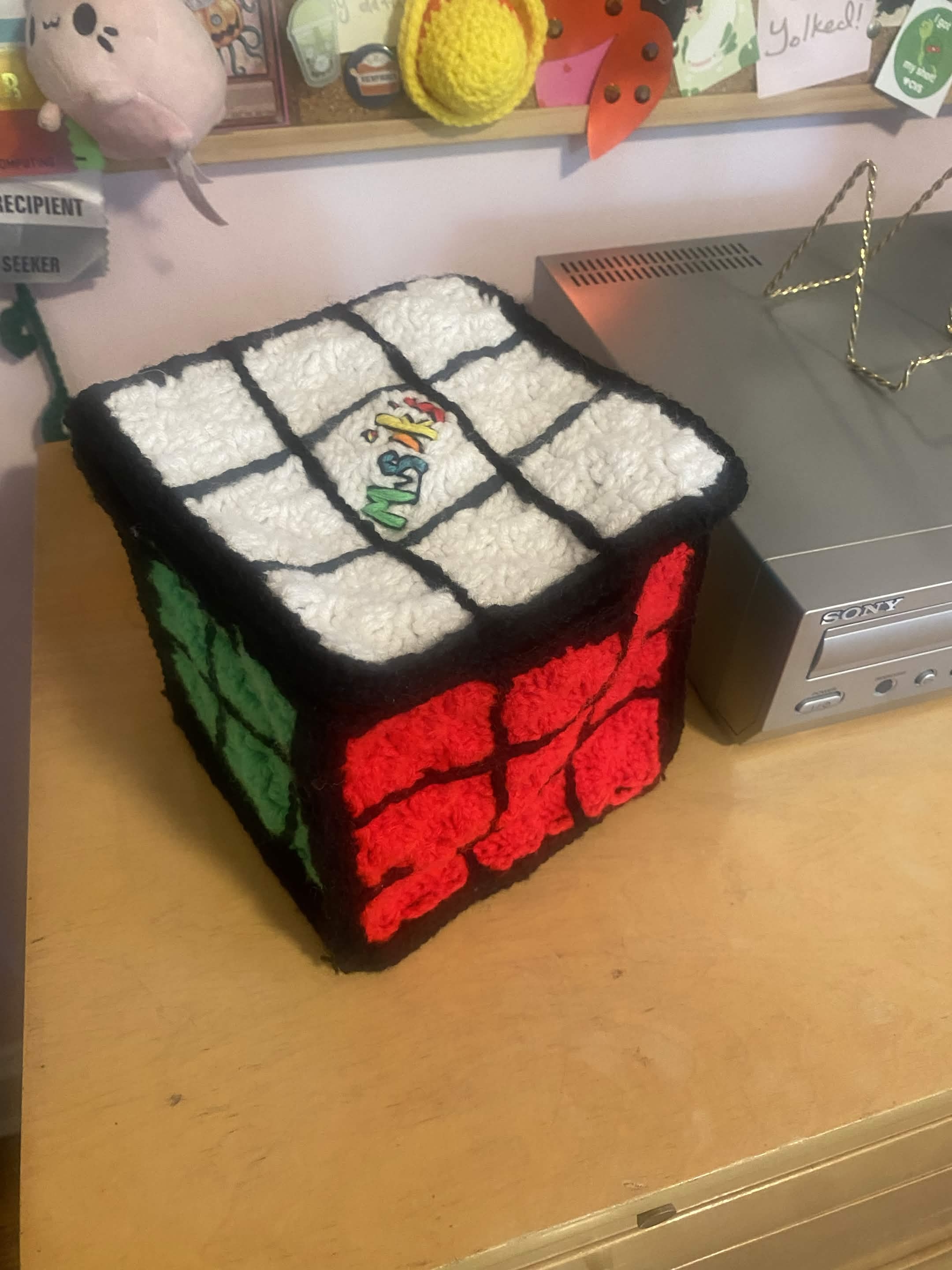 soft multi-colored cube shaped bag - label on top read's musik's in font of original rubix cube